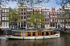 Street scene. Boathouse in an Amsterdam Channel. The Netherlands