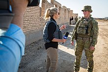 A Nine Network journalist interviewing an Australian soldier in Iraq during 2017 Australian media interviews an Australian army trainer at Camp Taji, Iraq, Feb. 26, 2017.jpg