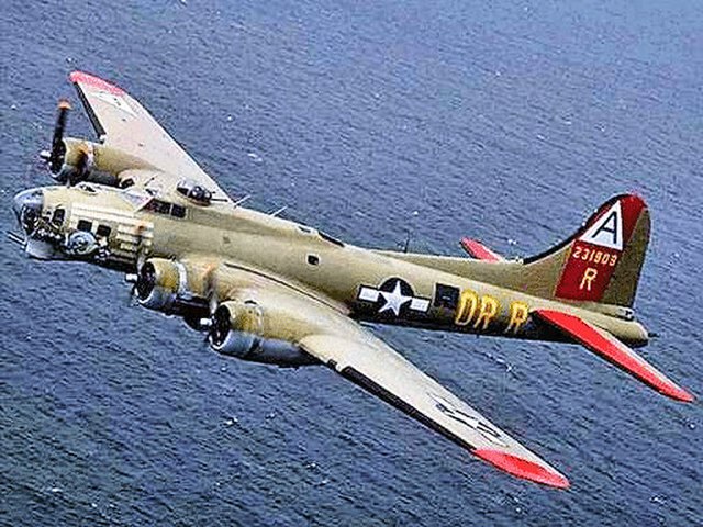 A Boeing B-17G in the markings of the 91st Bomb Group and displaying fuselage codes, tail symbols, and 1st Combat Bomb Wing color markings