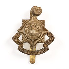 Cap badge of the Royal Sussex Regiment. Badge, regimental (AM 790969-1).jpg