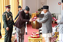 B. Pandey holding the janasewa shree bibhushan from president