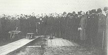 Lord Windsor (later Earl of Plymouth) holds out spade to cut the first sod of Barry Dock on Castleland Point in 1884 Barry Docks1.jpg