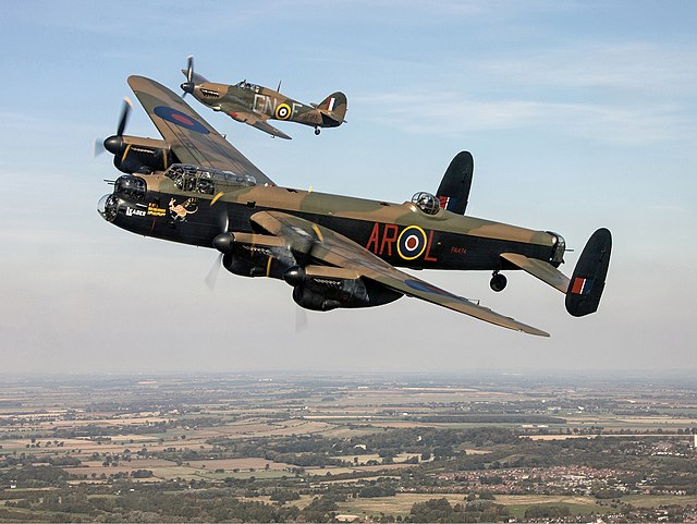 Lancaster B I PA474 in 460 Squadron (RAAF) colours, escorted by Hurricane Mk.IIc LF363 in 249 Sqn livery operated by the Battle of Britain Memorial Fl