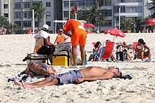A beach vendor of Biscoito Globo and Matte Leao, at Copacabana beach Beach Scene - Copacabana Beach - Rio de Janeiro - Brazil - 06.jpg