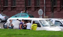 Plain-clothed officers detaining a protester in Minsk, 15 July BelRevJuly13f.jpg