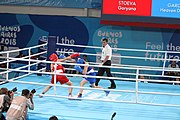 Deutsch: Boxen bei den Olympischen Jugendspielen 2018 Tag 12, 18. Oktober 2018 - Kampf um die Bronzemedaille im Fliegengewicht Mädchen – Heaven Destiny Garcia (USA, blau) schlägt Goryanana Stoeva (Bulgarien, rot) 5-0; Ringrichter ist Ishanguly Meretnyyazov (Turkmenistan). English: Boxing at the 2018 Summer Youth Olympics on 18 October 2018 – Girl's flyweight Bronze Medal Bout - Heaven Destiny Garcia (USA, blue) beats Goryanana Stoeva (Bulgaria, red) 5-0; Referee is Ishanguly Meretnyyazov (Turkmenistan). Español: Boxeo en los Juegos Olímpicos Juveniles de Verano de 2018 en 18 de octubre de 2018 - Combate a medalla de bronce de peso mosca para mujeres: Heaven Destiny Garcia (Estados Unidos, azul) le gana a Goryanana Stoeva (Bulgaria, roja) 5-0; El árbitro es Ishanguly Meretnyyazov (Turkmenistán).