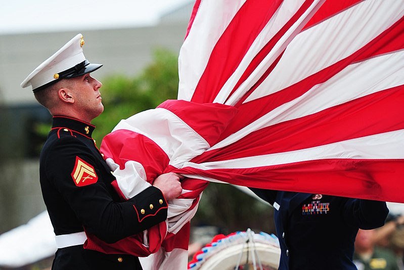 File:Defense.gov News Photo 110916-F-WA575-460 - A United States Marine takes the American flag into his hands before folding it with the flag detail at the POW MIA Remembrance Day retreat ceremony.jpg