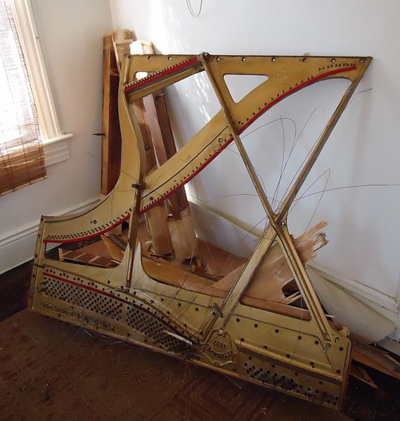 File:Demolition of upright Knabe piano cast iron string frame.JPG