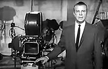 Dick Powell performing the introduction to "The Play Tonight", in which he introduced the performers. Dick Powell Show - Introduction.jpg