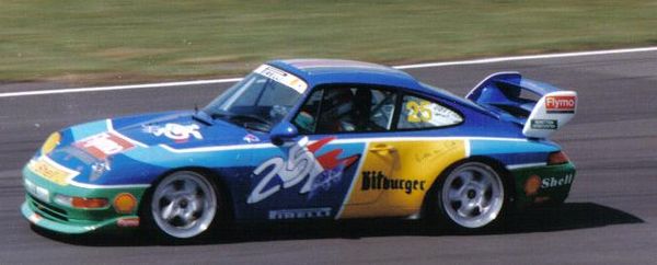 Collard driving in the Porsche Supercup in 1995. His car's livery reflects his role as the Benetton Formula One team's test driver.