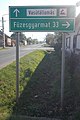 Füzesgyarmat and train station road sign, 2018 Karcag.jpg