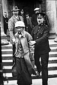 Fanny Parker being escorted out from Ayr Sheriff Court Fanny Parker, suffragette, 1914.jpg