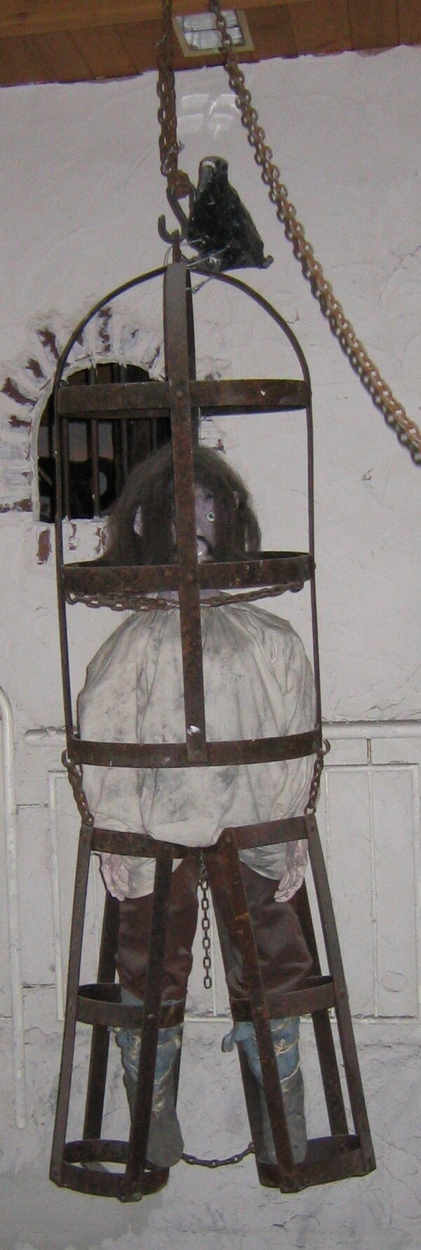 A gibbet with a dummy inside