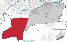 Karte mit dem Bezirk (in Rot) innerhalb des Bezirks (in Dunkelgrau) und dem Rest der Stadt (in Hellgrau)