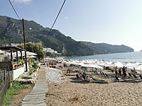 beach strip with deckchairs free of charge for restaurant customers of "AlcBar", North)