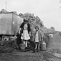 Girls carrying water, Anglesey (5370510430).jpg