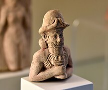 God Ea, also Enki, holding a cup with overflowing water. From Iraq. Pergamon Museum.jpg