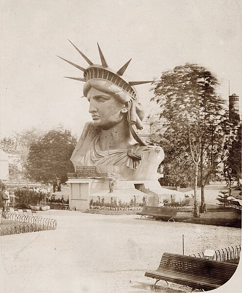 https://upload.wikimedia.org/wikipedia/commons/thumb/5/57/Head_of_the_Statue_of_Liberty_on_display_in_a_park_in_Paris.jpg/495px-Head_of_the_Statue_of_Liberty_on_display_in_a_park_in_Paris.jpg