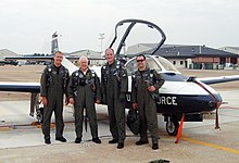 Ferris with three Air Force instructor pilots, following an Air Force Art Program flight.