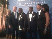 Kingsley Kuku auf Fotografien mit den Obamas