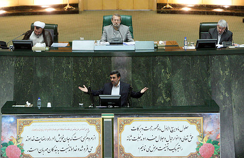 Ahmadinejad speaking in the Majlis, Chairman Ali Larijani is also pictured