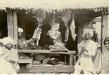 Kashmiri butcher (c.1900) Meat shop in market in Kashmir, India (c. 1900).jpg