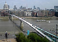 The Millennium Bridge over the River Thames in London, from Tate Modern. St. Pauls Cathedral on the left