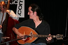 An Algerian mandole or mandolute, played by a member of Mon côté punk.