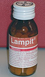 A brown glass bottle of pills, labeled "Lampit (nifurtimox)"