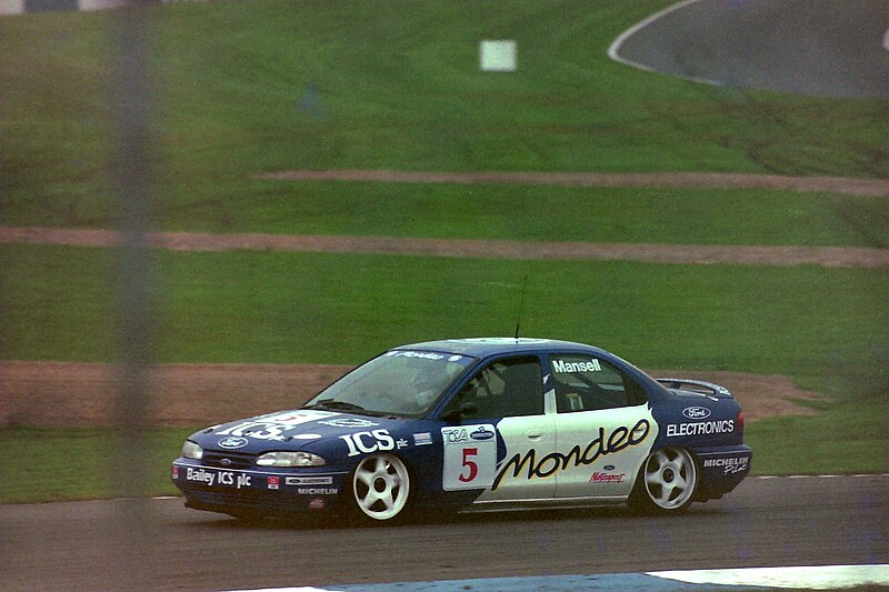 File:Nigel Mansell - Ford Mondeo Si exits the Old Hairpin at the 1993 TOCA Shootout, Donington (50094067821).jpg
