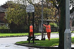 Here, two workers dig a deep hole next to an older metal lamp post on the corner of Patrington Garth ahead of the installation of a new post later in the afternoon.