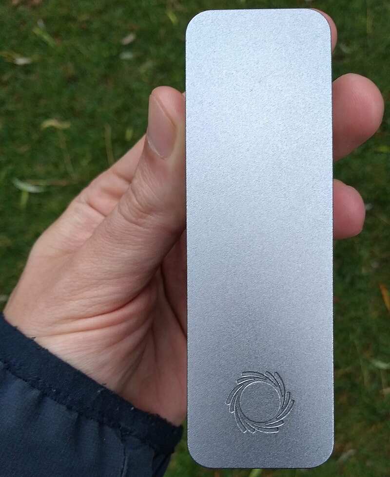 Oxford Nanopore MinION (tm) sequencer held in hand