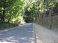 Mohrenstrasse at the upper end, view downhill.  On the right the retaining wall to the property with the mistress castle