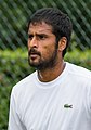 Saketh Myneni competing in the second round of the 2015 Wimbledon Qualifying Tournament at the Bank of England Sports Grounds in Roehampton, England. The winners of three rounds of competition qualify for the main draw of Wimbledon the following week.