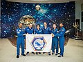 Soyuz MS-15 prime and backup crews at the Baikonur Cosmodrome Museum.jpg