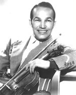 A dark-haired man wearing a light-coloured jacket and holding a violin