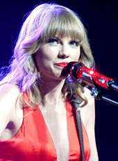 Taylor Swift in a crimson dress.
