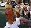 "Corny dogs" being eaten at the Texas State Fair