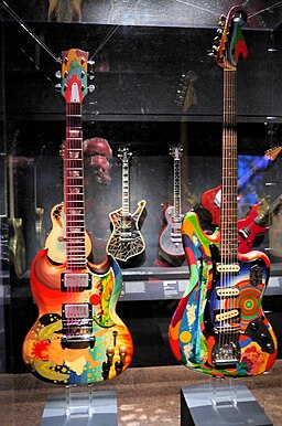 The Fool SG (1964 Gibson SG) played by Eric Clapton, and The Fool Bass VI (1962 Fender Bass VI) played by Jack Bruce - both painted in 1967 by The Fool Collective - Play It Loud. MET (2019-05-13 19.29.06 by Eden, Janine and Jim)
