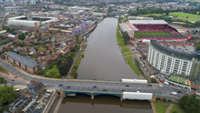 Meadow Lane (left) and the City Ground (right) either side of the River Trent, the two closest professional football grounds in England The two closest football grounds in England (50285299147).png