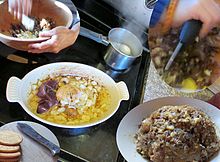 Chopped liver made by sauteing turkey liver and onions in turkey schmaltz, then chopping in a wooden bowl with hard-boiled egg, served with crackers Turkey chopped liver.jpg