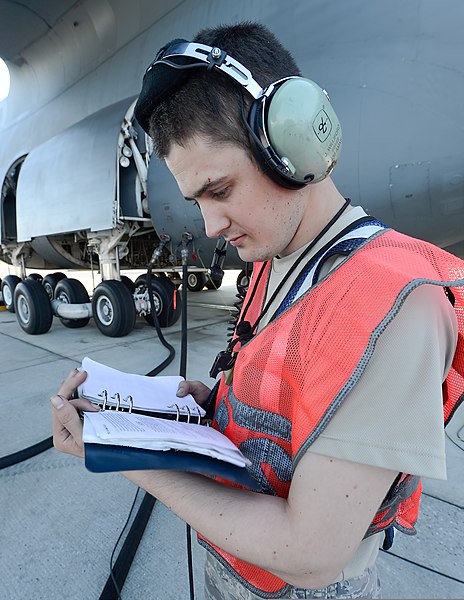 File:U.S. Air Force Senior Airman Justin Williford, a C-5 Galaxy aircraft crew chief assigned to the 436th Aircraft Maintenance Squadron, reviews a technical manual during a refueling operation at Dover Air Force 131002-F-VV898-003.jpg