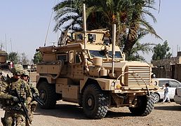 U.S. Army Staff Sgt. Joshua White, a member of the Farah Provincial Reconstruction Team (PRT), leads a security team during a key leader engagement in Farah, Afghanistan, Aug. 29, 2012 120829-N-II659-0701 (cropped).jpg