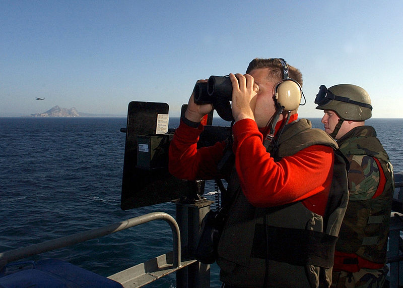 File:US Navy 040710-N-4953E-013 Gunner's Mate 2nd Class Charles Capps looks for ship contacts as Machinist's Mate 2nd Class Walter Blackburn mans a .50 caliber gun mount as USS Harry S. Truman (CVN 75) transits the Strait of Gibralt.jpg