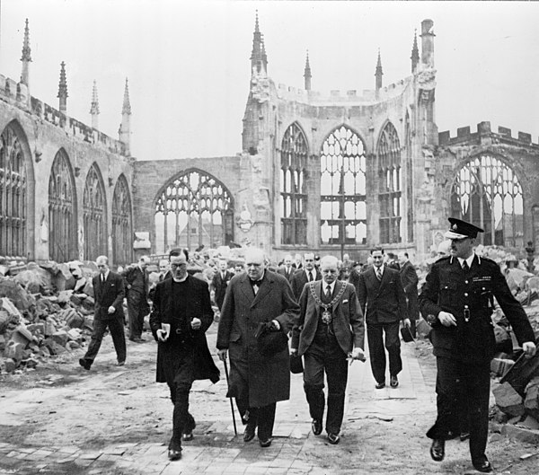 Winston Churchill, the Mayor J. A. Moseley, the Bishop of Coventry M. G. Haigh, the Deputy Mayor A. R. Grindlay, and others visiting the ruins of Cove