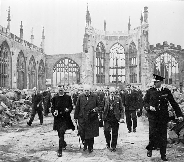 Winston Churchill, the Mayor J. A. Moseley, the Bishop of Coventry M. G. Haigh, the Deputy Mayor A. R. Grindlay, and others visiting the ruins of Cove