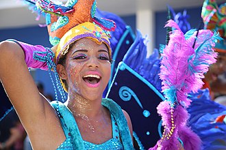 Taxi companies prefer not to give rides to people wearing glitter makeup that leaves residue in the vehicle. Woman in blue parade costume (Atsme).jpg