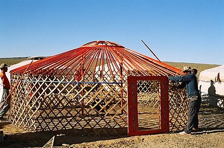A Yurt or ger, a circular dwelling from Mongolia, during erection