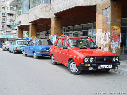 Dacias parked up along a Romanian street
