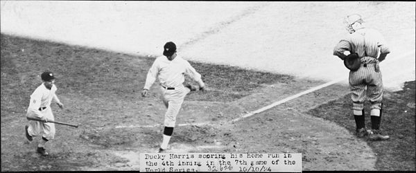 Washington's Bucky Harris scores on his home run in the fourth inning of Game 7 of the 1924 World Series.